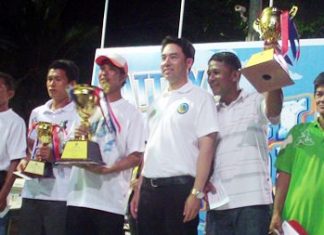 Itthiphol Kunplome, mayor of Pattaya city, presents trophies to the winners.