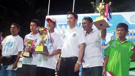 Itthiphol Kunplome, mayor of Pattaya city, presents trophies to the winners.
