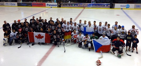 The 2 teams line up together after the game. (Photo/Julie Lestage)