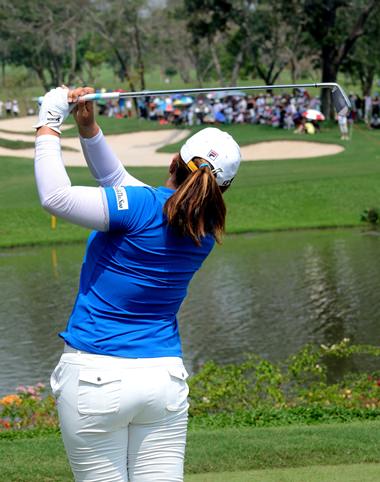 Defending champion Inbee Park of Korea tees off on the short par-3 eighth hole during her final round 66.