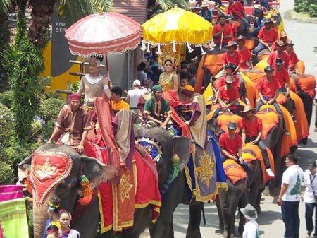 The parade of elephants makes its way towards the feasting grounds.
