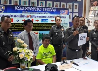 Police finally caught up with Belgian fugitive Tcheou Joel Tcharada (seated), wanted for allegedly murdering his wife.