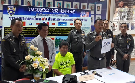 Police finally caught up with Belgian fugitive Tcheou Joel Tcharada (seated), wanted for allegedly murdering his wife.