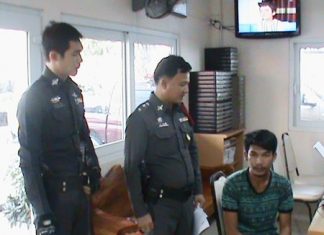 Police say Supparuek Topa (seated, right) has confessed to stealing a South African expat’s car and more than 100,000 baht in cash and electronics.