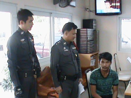 Police say Supparuek Topa (seated, right) has confessed to stealing a South African expat’s car and more than 100,000 baht in cash and electronics.