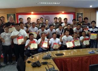 Pattaya Police Superintendent Col. Supachai Phuikaewkhum (back row 6th right) presides over the certificate ceremony for the first graduating class of police volunteers for 2014.