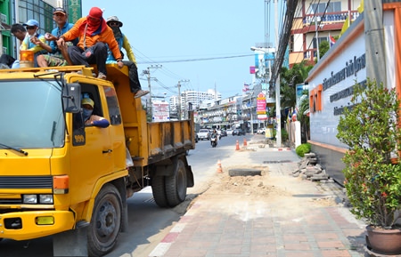 Once press inquiries began, workers hurriedly brought in trucks to clear some of the debris.