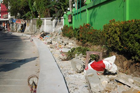 Construction is progressing slowly on a 3 million baht raised wheelchair path near the Redemptorist Vocational School for Persons with Disabilities.  The path is critical for wheelchair using residents at the school, for the area can be quite dangerous.  City hall says the delay is due to a shortage of construction workers, which, as shown in this photo, means no workers in the middle of the afternoon.