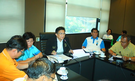 Deputy Mayor Wutisak Rermkitkarn (center) and Ms. Pannee Limcharoen (to his right) discuss a community foot-mapping project with local officials.