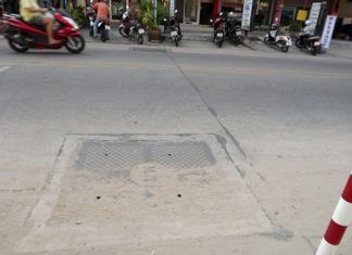 One of the newly installed storm-drainage lids with only 4 small holes which residents say will make rainy season flooding worse.