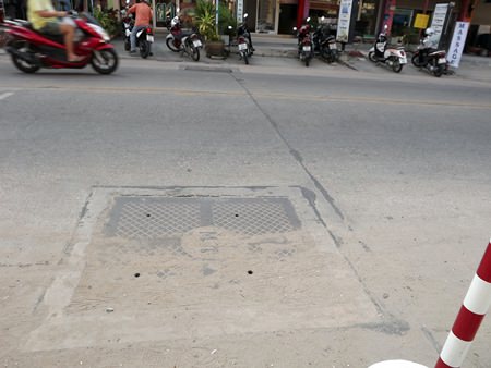 One of the newly installed storm-drainage lids with only 4 small holes which residents say will make rainy season flooding worse.