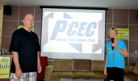 PCEC chair Pat Koester and logo selection committee chair Roy Albiston unveil the PCEC’s new logo to the members. (Photo by Urasin Khantaraphan)