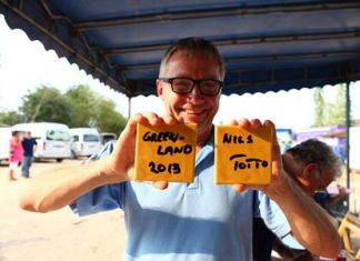 Totto Befring shows off two of the signed tiles at Baan Jing Jai. (Photo: Dujdao Udomsin)