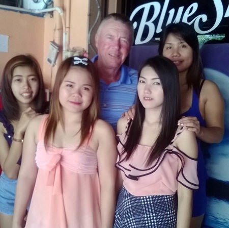 Kit (center) poses with staff from the Blue Sky Bar.