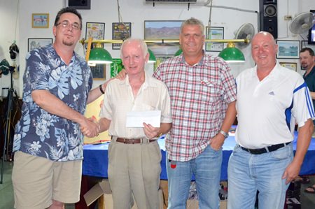 Mike Contoni (left) presents to the winning team members, Joe McArdle, Shaun Merriman and George Cullen.