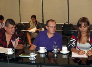 Jean Luc Rosticci of the Petanque 9 Rai Club (left) talks with committee members during the planning meeting for the tournament on Feb. 24.
