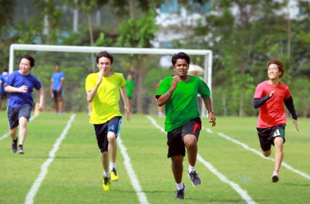 GIS students race for the line in the 100m sprint.
