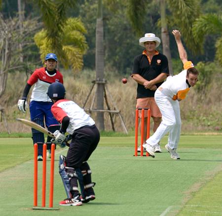 Andy Emery bowls to Fon during the first innings.
