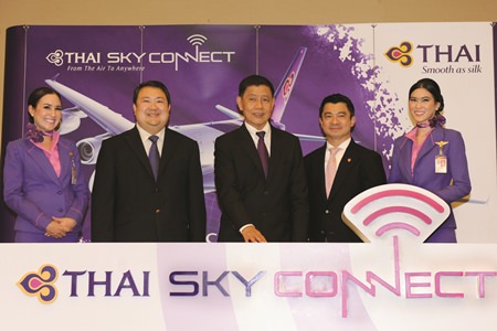 Chokchai Panyayong (center), THAI senior executive vice president of Commercial, and acting president, and Danuj Bunnag (second from left), THAI executive vice president, Products and Customer Services, launched THAI Sky Connect service that provides wireless internet connection (WiFi) on board flights operated with Airbus A330-300 and A380-800 aircraft in all classes of service. Dr. Settapong Malisuwan (second from right), vice chairman of the National Broadcasting and Telecommunications Commission (NBTC), joined the event at THAI’s head office on Vibhavadi Rangsit Road.