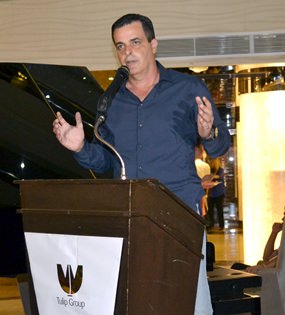 Tulip CEO Kobi Elbaz updates guests at the March 20 party on progress of the Waterfront Suites & Residences development.