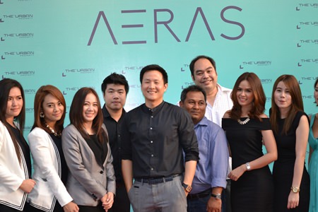 The Urban Property Managing Director Sompop Vanichsenee (center) poses with management colleagues and sales staff at the Aeras Condominium agents’ party held March 28.
