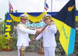 Artillery chief to take over Frigate Squadron 2 Capt. Sompong Phuwiang hands over the company flag to Capt. Somprasong Witladilokphan.