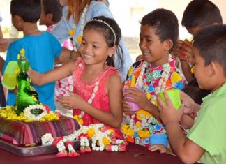 Fifty happy children from the Fountain of Life Children’s Center were introduced to the traditional side of Songkran during a Thai New Year celebration at the day-care center. As shown here, they certainly enjoy pouring water on their Buddha statue. However, when traditional activities finished, they, too, brought out the water buckets for a modern Songkran water fight.