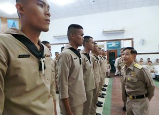 Vice Adm. Wattanachai Piyaphat inspects the troops before sending them off to receive vocational training.