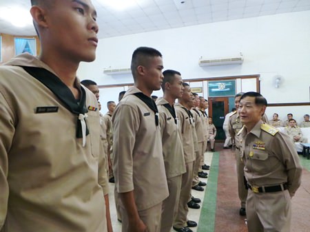 Vice Adm. Wattanachai Piyaphat inspects the troops before sending them off to receive vocational training.