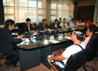 Deputy Mayor Ronakit Ekasingh (left) presides over a safety meeting with local sea walker operators.