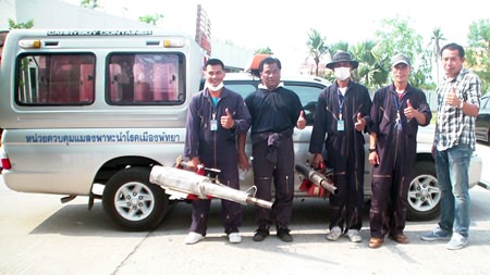 Mayoral advisor Phassakorn Yusombun leads a team to spray three Pattaya streets with pesticides to kill mosquitoes in continuing efforts to eradicate dengue fever.