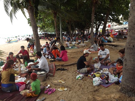 Many Bangkok denizens came to the city to celebrate, but instead of street food and restaurants, many brought their own cooking gear and ate on the beach.