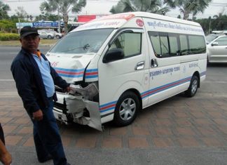 Van driver Pomuao Hadgadeang points to the damage on his van.