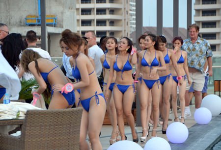 Contestants pick up their robes after the photo shoot.