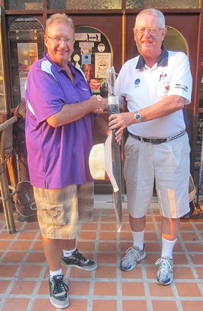 Dick Warberg (right) presents the MBMG Group Golfer of The Month award to Andre Van Dyk.