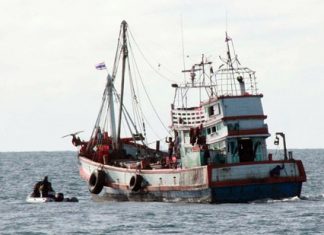 On edge of U.S. sanctions, Thailand officials order human-trafficking inspection in Sattahip An inspection crew prepares to board a local fishing vessel.