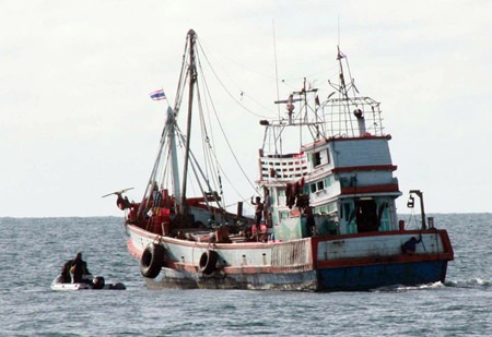 An inspection crew prepares to board a local fishing vessel.