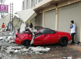 At press time, it is unknown who owned this little red Ford Aspire, but luckily no one was inside this when bricks fell on it from above. Ubon Kaewkoon’s damaged pickup is behind the fallen canopy in the background.