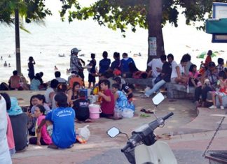 ASEAN citizens relax on National Labor Day at Jomtien Beach.