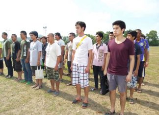 Phanu “Poppy” Jirakhun (front right), leader of the band K-otic, reports for military duty at the Naval Recruit Training Center.