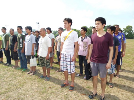 Phanu “Poppy” Jirakhun (front right), leader of the band K-otic, reports for military duty at the Naval Recruit Training Center.