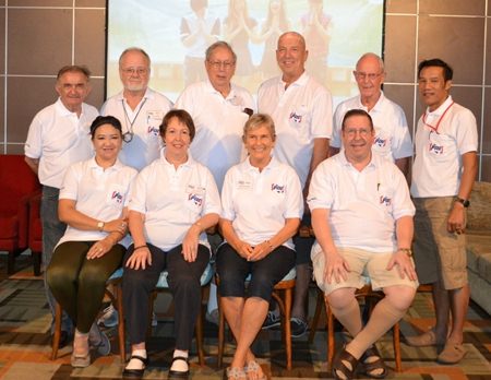 Members of the Board and others show off the club Polo shirt, featuring the new club logo.