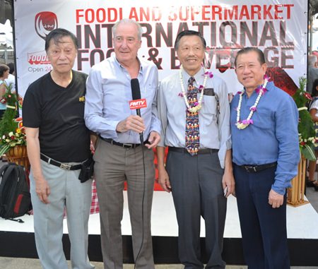 Dr. Iain Corness (2nd left) interviews for PMTV (L to R) Chairman Frank Lim, MD Edwin Lim, and Somsak Teerapattanakul, CEO of Foodland Co., Ltd.