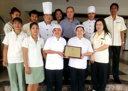 Rene Pisters (3rd right rear), GM of the Thai Garden Resort stands proudly with his team after having received the prestigious award from the Department of Tourism, Ministry of Tourism and Sports.