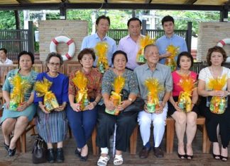 Mitr and Wattana Rattanaopat (seated, center) and family members held the ceremony to mark the 26th anniversary of the A-One Royal Cruise Hotel.