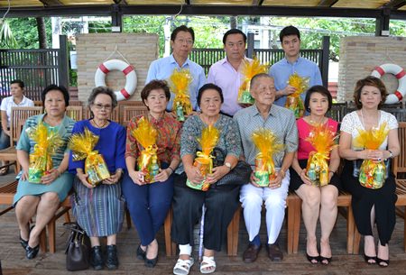 Mitr and Wattana Rattanaopat (seated, center) and family members held the ceremony to mark the 26th anniversary of the A-One Royal Cruise Hotel.