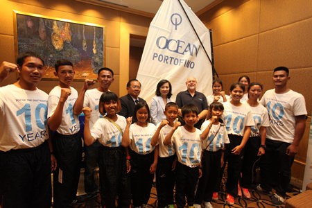 Captain Bundit Kongyai, Chief of Yacht Racing Association of Thailand (standing back row 4th left), Supatra Angkavinijwong, Deputy Managing Director of Ocean Property Co., Ltd. (back row centre), and William Gasson, Chairman of Top of the Gulf Regatta 2014 (back row 3rd right) are ready to welcome sailors to the 10th anniversary Top of the Gulf Regatta. 