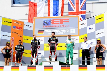 Sandy Stuvik (center) stands on the podium as the Thai national anthem is played at the end of race 2 of the opening weekend of the EuroFormula Open at the Nurbürgring in Germany, Sunday, May 4.