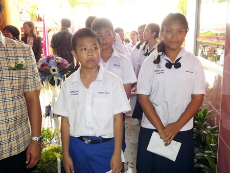 Students queue to open their bank accounts.