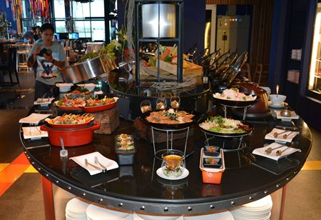 The buffet station offers a variety of seafood and Thai dishes.